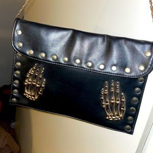 Black skeleton hands cross body purse